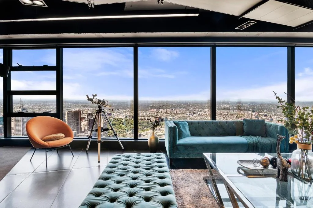 Living room and Melbourne view at the Eureka Tower penthouse